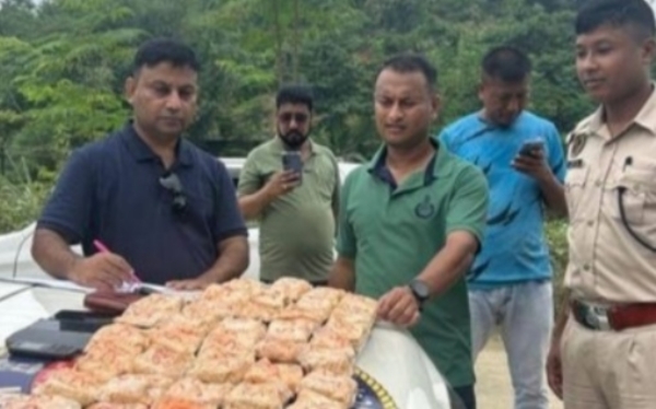 Karimganj: image of the four arrested drug peddlers with 548.82 grams of heroin.