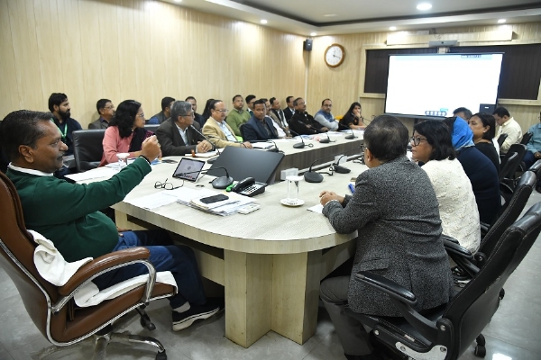 Image of the Health Minister Singhal reviewing the organizational structure of Directorate.