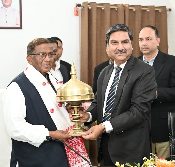 Image of the Governor Laxman Prasad Aacharya chairing the meeting with functionaries of SriSri Aniruddhadeva Sports University.