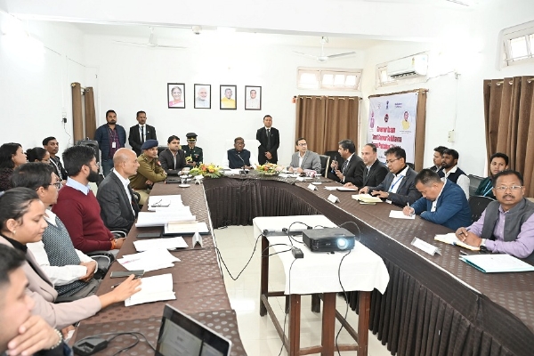 Image of the Governor Laxman Prasad Aacharya chairing the meeting with functionaries of SriSri Aniruddhadeva Sports University.