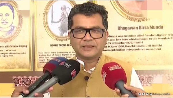 Union minister Margherita talking to media.