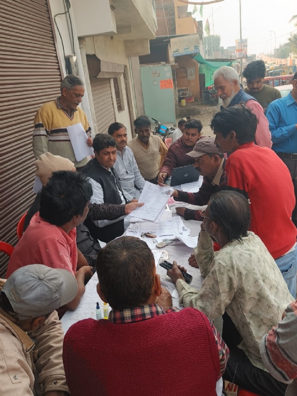 MP Ujjwal Raman Singh reviewing voters forms