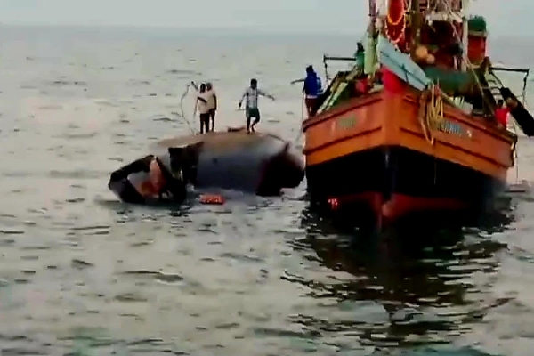 The trawler being brought to the shore The trawler being brought to the shore