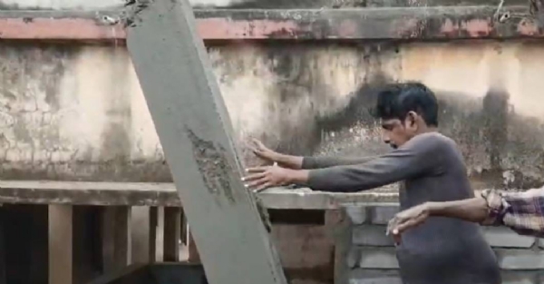 A man pushing the pillar