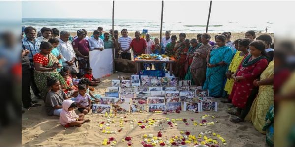 Silent processions and floral tributes mark 21st tsunami anniversary