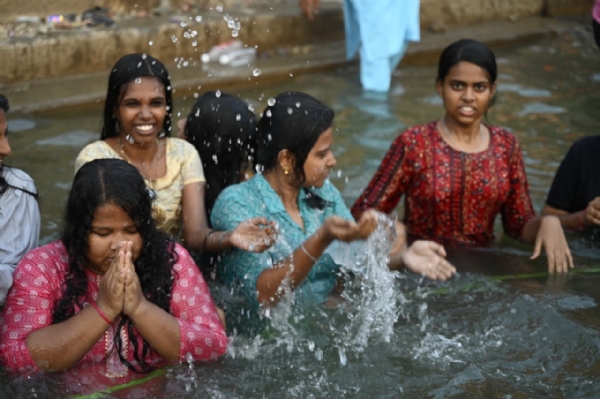Students take holy dip in Ganga