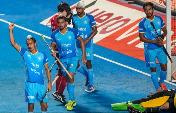 Indian junior players celebrate after a dominant win as an Indian attacker raises his fist while teammates walk off the blue turf during the FIH Hockey Men’s Junior World Cup in Tamil Nadu. Indian junior players celebrate after a dominant win as an Indian attacker raises his fist while teammates walk off the blue turf during the FIH Hockey Men’s Junior World Cup in Tamil Nadu.