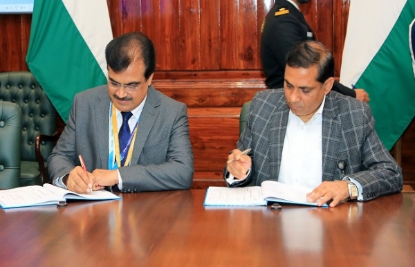 Officials signing contract to purchase software defined radios for Indian Coast Guard