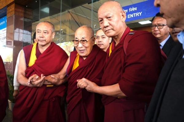 Tibetan Buddhist monks welcoming His Holiness the Dalai Lama on his arrival at Gaggal Airport.