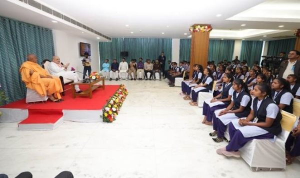 Union Home and Cooperation Minister Amit Shah with students from rural and tribal society of Santokba Dholakia Vidya Mandir of Dang district of Gujarat at Gujarat Bhavan in Chanakyapuri, New Delhi