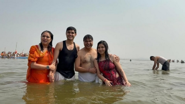 Assam Chief Minister Himanta Biswa Sarma taking bath in Mahakumbh with his family.