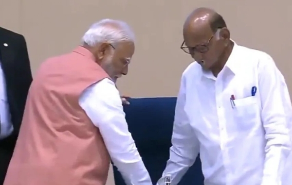 PM Modi pours water, fixes Pawar’s seat at event