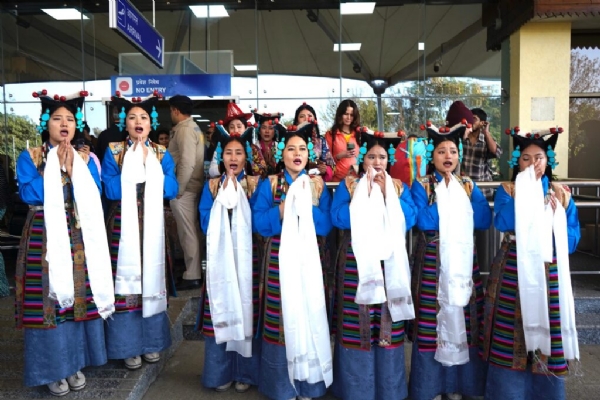 Tibetan women standing in welcome.