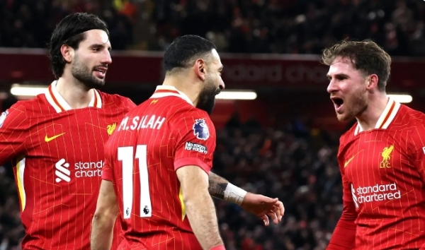 Liverpool players celebrate after a goal