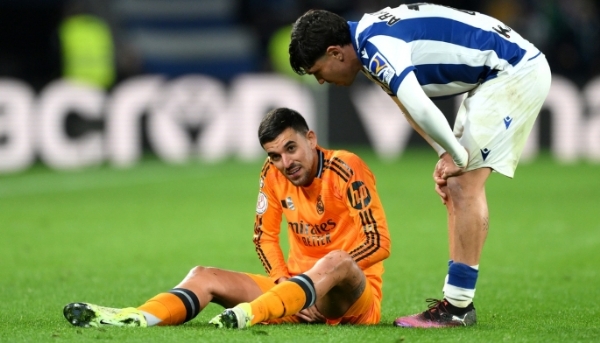 Dani Ceballos sits on the field after suffering an injury