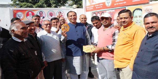 BJP State President Mohanlal Badauli celebrates victory with workers with Jalebi in Delhi