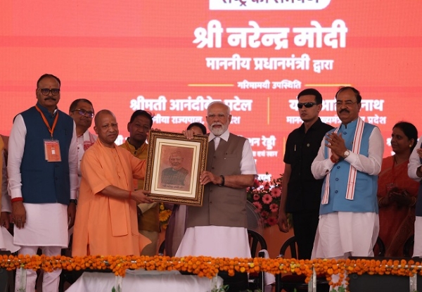 Yogi addressing the gathering in Kanpur on Friday