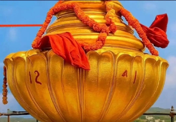 Shining shikhara (spire) studded with gold Shining shikhara (spire) studded with gold