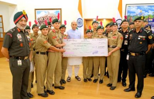 Presents a cheque of Rs 10 lakh for the extraordinary feat