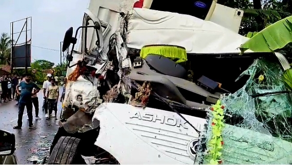 Head-on collision between bus and container