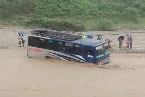 Bus caught in flash flood in Madarihat