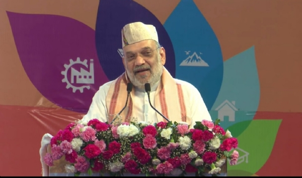 Home Minister Amit Shah addressing the Investment Festival program in Rudrapur.