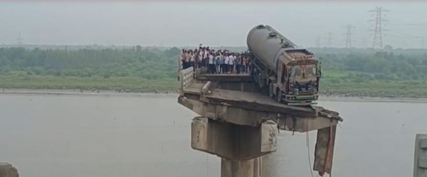 In Anand, Gujarat, a bridge collapsed, causing four vehicles to fall into the river, resulting in three deaths.