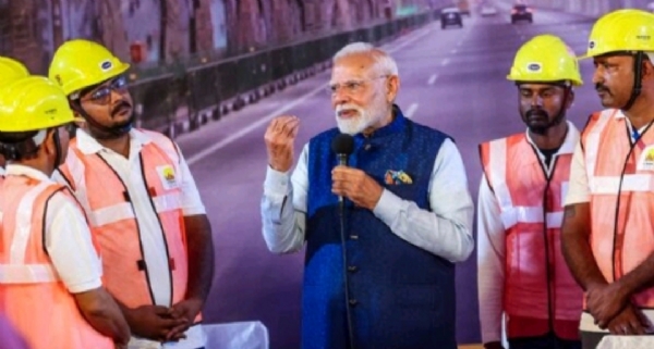 Prime Minister Narendra Modi interacting with workers