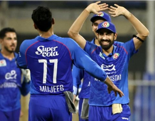 Afghan players celebrating after dismissing UAE captain Mohammad Wasim .
