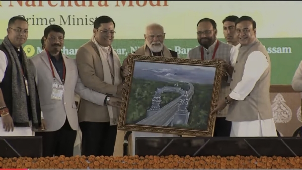 PM Narendra Modi with Assam Chief Minister Himanta Biswa Sarma, Union Ports Minister Sarbananda Sonowal