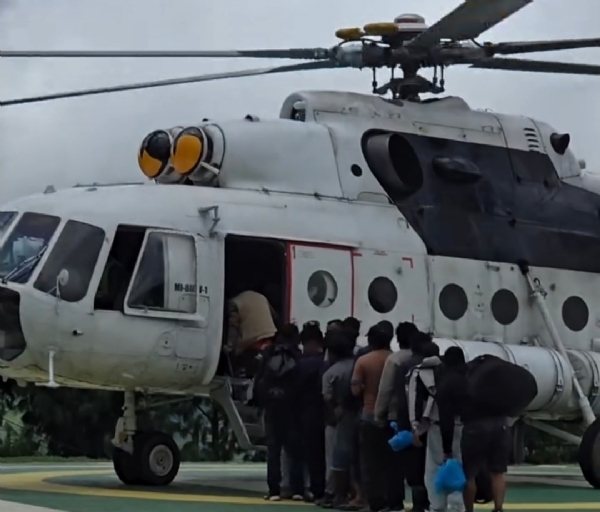People stranded by the floods were airlifted to safety by a Nepal Army helicopter.