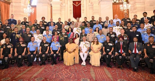 President Droupadi Murmu interacts with faculty members and participants of the 66th course of the National Defence College (NDC) at Rashtrapati Bhavan on Tuesday.