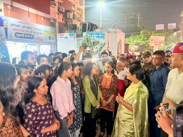Delhi Chief Minister Rekha Gupta interacts with students during an engagement aimed at encouraging dialogue and understanding their perspectives on education and student welfare.