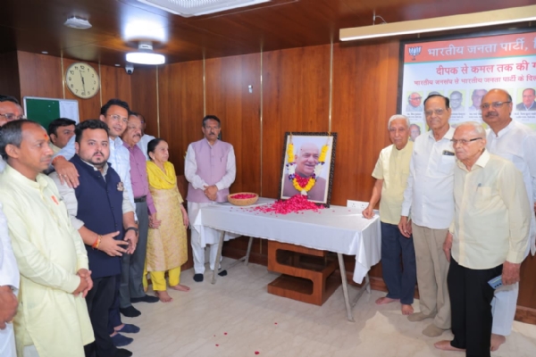 BJP leaders and party workers join Harsh Malhotra at a tribute ceremony commemorating the birth anniversary of Madan Lal Khurana.