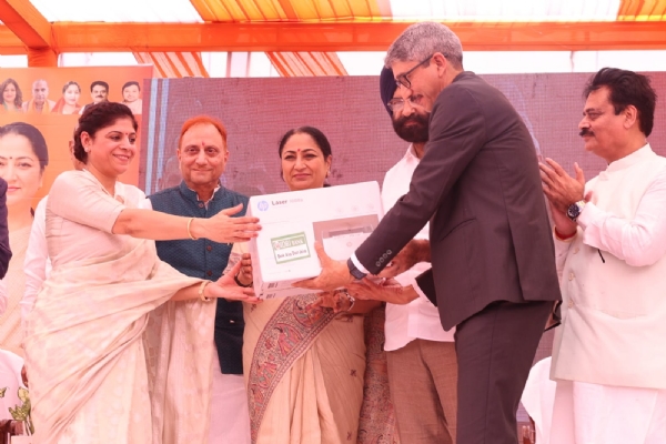 Delhi Chief Minister Rekha Gupta distributes printers to 1,500 municipal corporation schools.