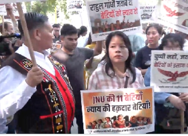 BJP workers from the Northeast march towards the Congress headquarters.