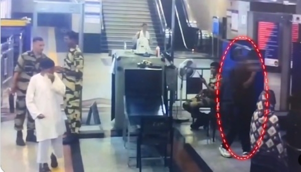 A passenger attempts to flee after a suspicious object is detected during X-ray screening at a metro station.