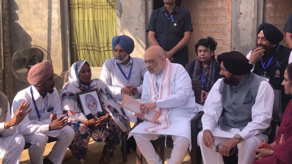 Home Minister Amit Shah meeting with the family members of Gulzar Singh in Toor Banjara village, Sangrur.