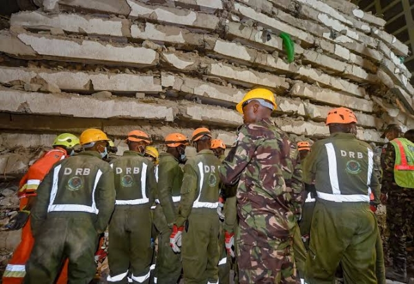 Rescue workers search through the rubble of a collapsed multi-storey building in Nairobi, Kenya, amid fears that people remain trapped underneath.