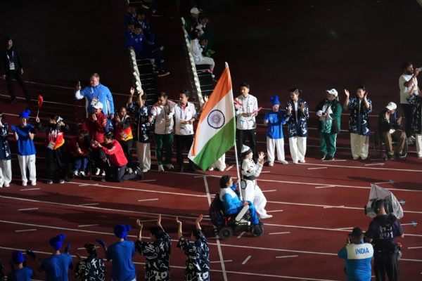 Indian flag-bearers march during the closing ceremony.