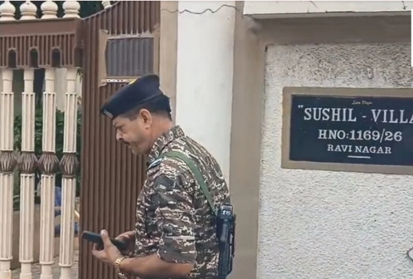Security officer stands outside Sushil Villa in the Pandri area of Raipur.