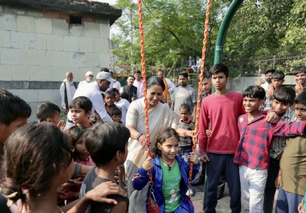 Delhi Chief Minister Rekha Gupta watches a child enjoying a swing during the inauguration of two newly developed children’s parks at Nehru Camp on Saturday. Delhi Chief Minister Rekha Gupta watches a child enjoying a swing during the inauguration of two newly developed children’s parks at Nehru Camp on Saturday.