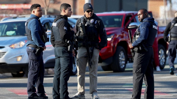 Police congregate near the Lynch Arena in Pawtucket, R.I., after a shooting at the ice rink, Monday, Feb. 16, 2026.