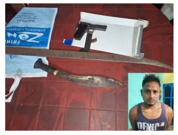 Image of the Youth Arrested with Pistol and Sword in Tezpur. Image of the Youth Arrested with Pistol and Sword in Tezpur.