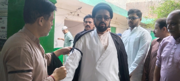 Muslims celebrated Eid with simplicity by tying black bands on their arms