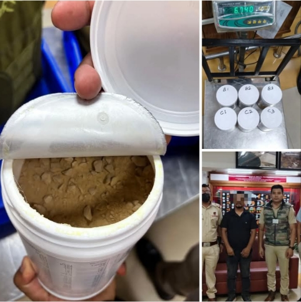 Image of the Arrested Drug Peddler At Imphal Airport. Image of the Arrested Drug Peddler At Imphal Airport.