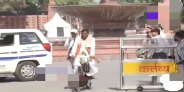 Teras Gowala Cycles to Parliament to Take Oath as RS MP