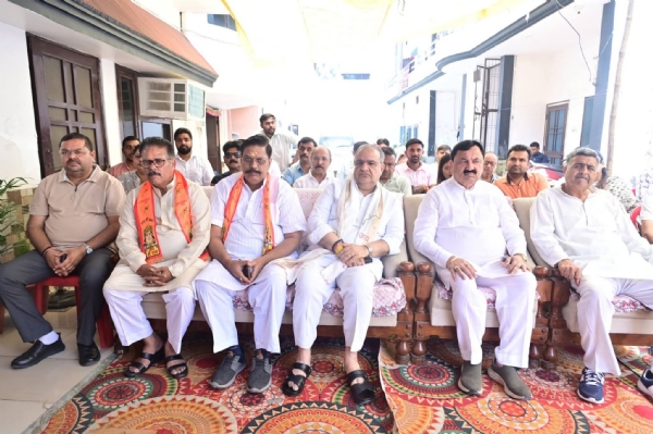 Chaudhary Bhupendra Singh listening to the Mann Ki Baat prog