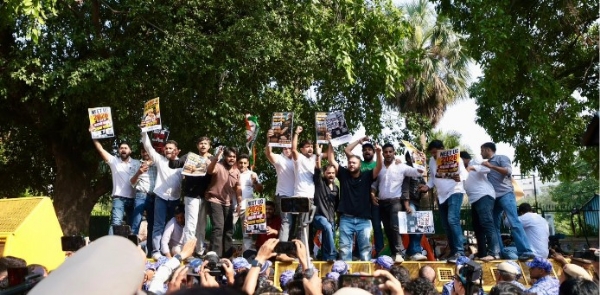 Protesters demonstrating outside the Youth Congress headquarters over the NEET paper‑leak case.