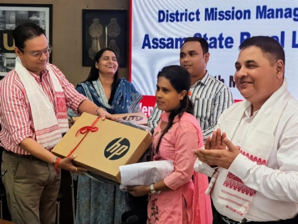 DigiPay Sakhis Receiving Laptops in Kamrup.